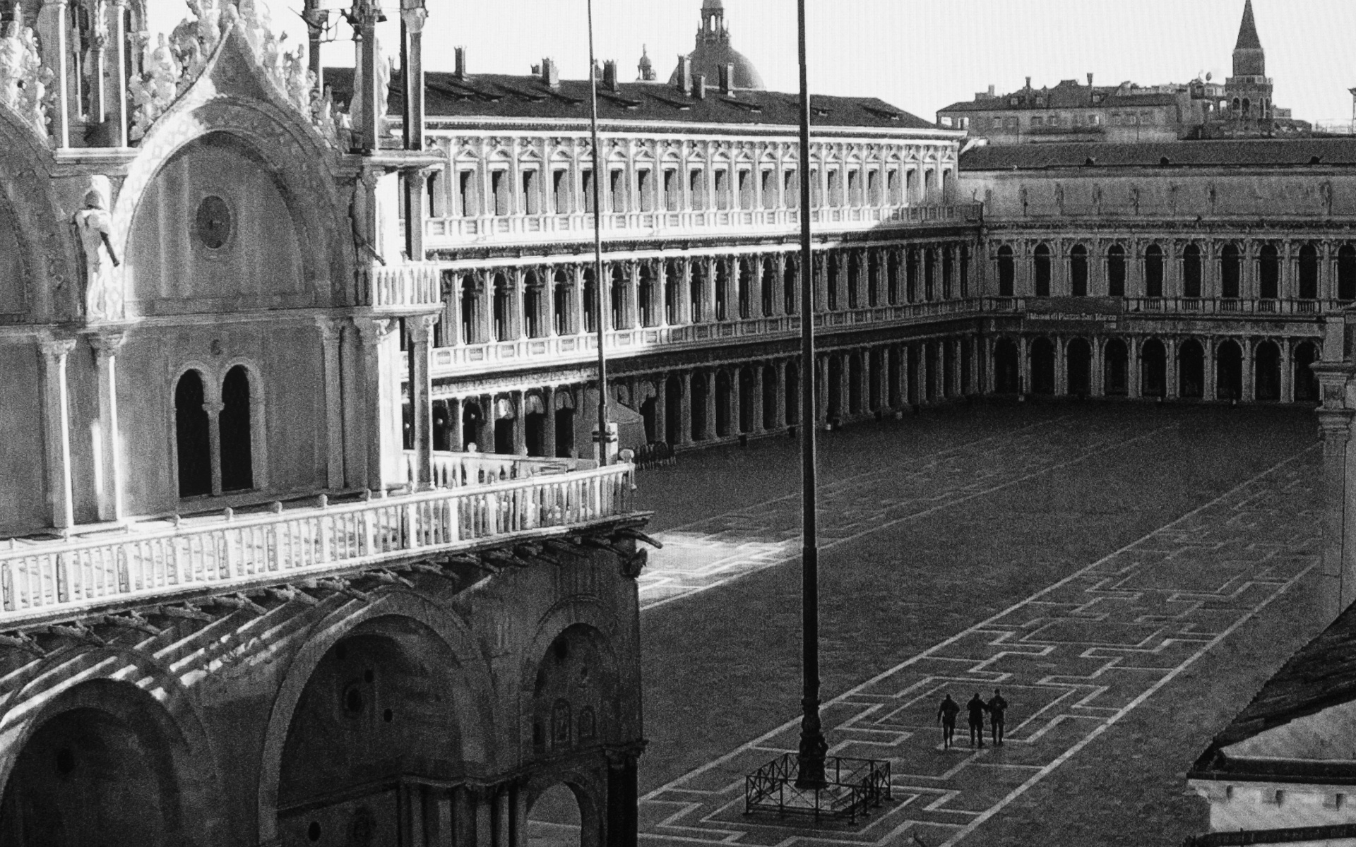 Venice, St Mark’s Square - Two soldiers and policeman crossing empty St. Mark
